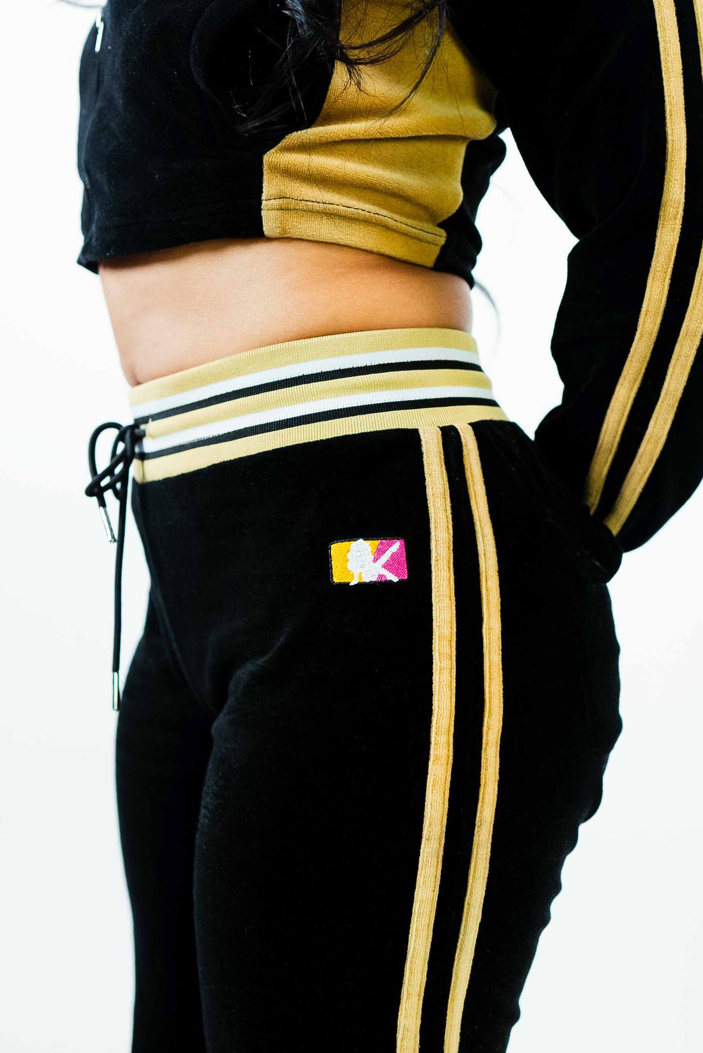 Female Players black velour tracksuit